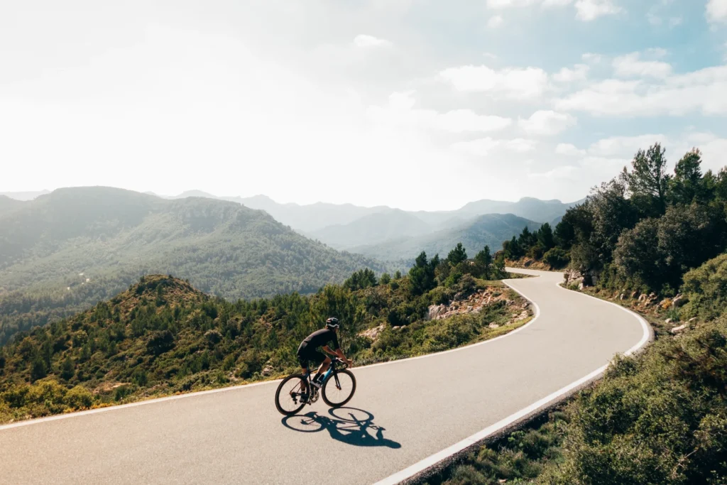 riding a bike on a mountain road