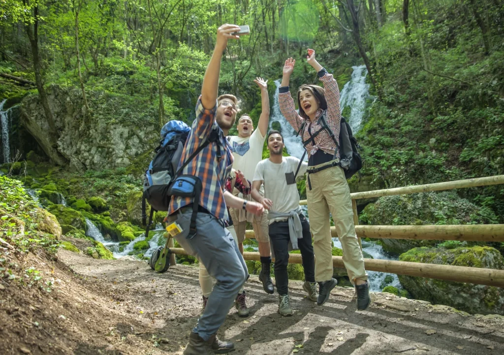 group of friends taking selfies