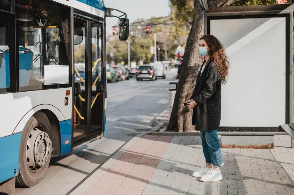 side view woman waiting bus