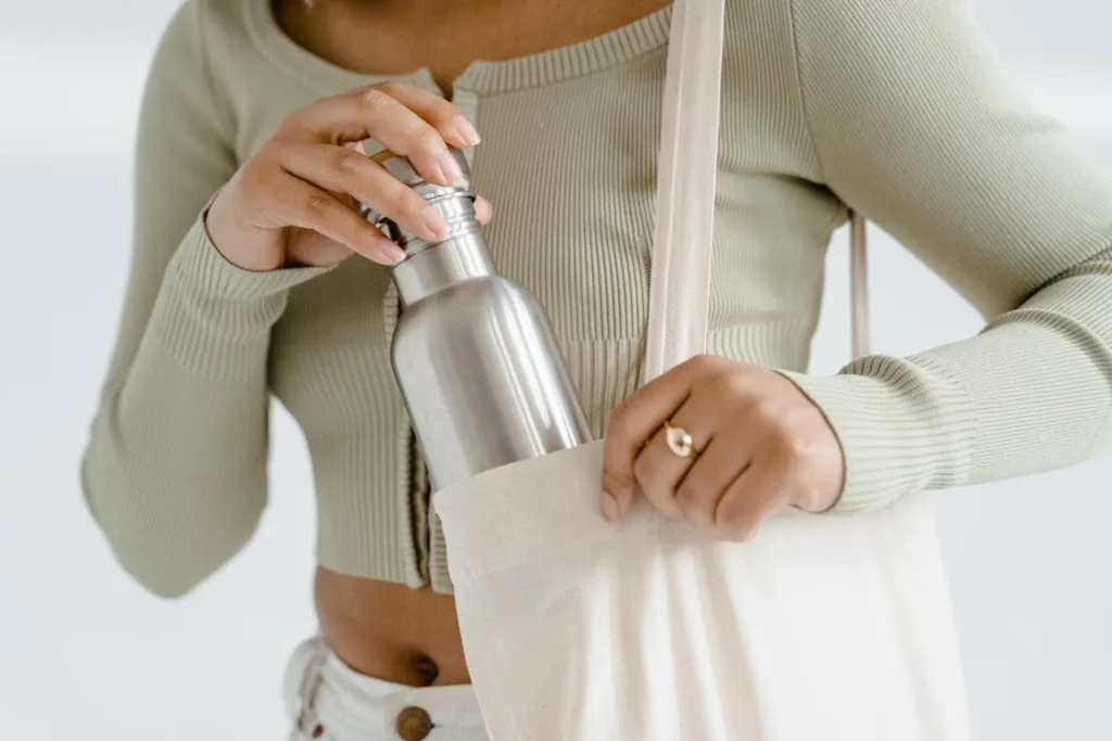 Woman with shopping bag and bottled water