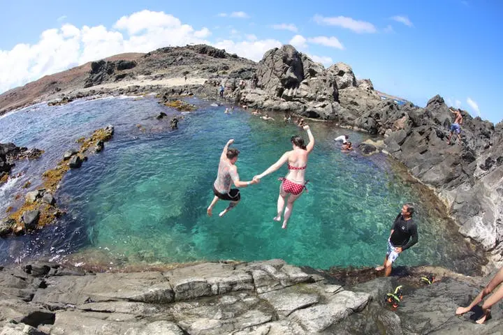 Couple Jumping at Arikok National Park